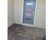 Stylish blue front door with decorative glass panels and modern hardware with a paved entry at 289 Aravalli Crest St, Henderson, NV 89015
