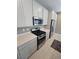 A gourmet kitchen features stainless steel appliances and quartz counters at 289 Aravalli Crest St, Henderson, NV 89015