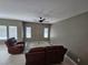 Inviting living room featuring a modern ceiling fan and neutral paint at 289 Aravalli Crest St, Henderson, NV 89015