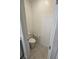 Toilet room featuring a toilet, paper holder, and safety handle at 289 Aravalli Crest St, Henderson, NV 89015