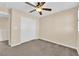 Bedroom with neutral decor, carpet, ceiling fan and closet with sliding doors at 3064 Bicentennial Pkwy, Henderson, NV 89044