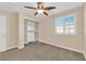 Neutral bedroom features a ceiling fan, window, and built in closet at 3064 Bicentennial Pkwy, Henderson, NV 89044