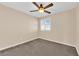 Neutral bedroom features a ceiling fan, plush carpeting, and natural light at 3064 Bicentennial Pkwy, Henderson, NV 89044