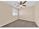 Neutral bedroom with a ceiling fan, plush carpeting, and natural light at 3064 Bicentennial Pkwy, Henderson, NV 89044