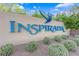 Beautiful community sign surrounded by manicured shrubs and lush greenery at 3064 Bicentennial Pkwy, Henderson, NV 89044