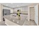 Kitchen features granite countertops, stainless steel appliances, and center island with dual sinks at 3064 Bicentennial Pkwy, Henderson, NV 89044