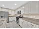 Modern kitchen showcasing granite countertops, stainless steel appliances, and ample cabinet space at 3064 Bicentennial Pkwy, Henderson, NV 89044