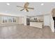 Open-concept living area featuring tile floors, recessed lighting, and seamless flow into the kitchen at 3064 Bicentennial Pkwy, Henderson, NV 89044