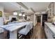 Large kitchen and island with seating and stainless steel appliances featuring an open floor plan concept at 3111 Bel Air Dr # 20H, Las Vegas, NV 89109