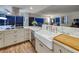 Farmhouse sink with marble countertop and wooden cutting board looking out to a spectacular Las Vegas view at 3111 Bel Air Dr # 20H, Las Vegas, NV 89109