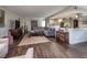 Spacious living room with hardwood floors, a comfortable gray couch, and an open-concept design at 3111 Bel Air Dr # 20H, Las Vegas, NV 89109