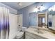 Bathroom with patterned countertop, white tile backsplash and shower at 3360 Paso Andres St, Las Vegas, NV 89146