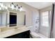 Neutral bathroom with patterned countertop, large mirror and tiled shower at 3360 Paso Andres St, Las Vegas, NV 89146