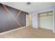 Bedroom features laminate floors, painted accent wall, and a closet at 3360 Paso Andres St, Las Vegas, NV 89146