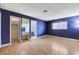 Bright bedroom features laminate floors, a window, closet, and ensuite bathroom at 3360 Paso Andres St, Las Vegas, NV 89146
