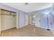 Bedroom features laminate floors, artist painted accent wall and closet at 3360 Paso Andres St, Las Vegas, NV 89146