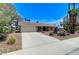 Charming single story home featuring a spacious driveway and xeriscaped front yard at 3360 Paso Andres St, Las Vegas, NV 89146