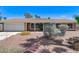 Charming single story home featuring a spacious driveway and xeriscaped front yard at 3360 Paso Andres St, Las Vegas, NV 89146