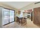 Eat-in kitchen with a breakfast bar, stainless appliances, sliding patio door, and plenty of cabinet space at 3360 Paso Andres St, Las Vegas, NV 89146