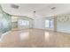 Bright living room with geometric accent wall and natural light at 3360 Paso Andres St, Las Vegas, NV 89146