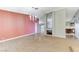 Open living room featuring a fireplace, wood floors, and modern chandeliers at 3360 Paso Andres St, Las Vegas, NV 89146