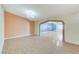 Bright living room featuring a large archway and decorative lighting at 3360 Paso Andres St, Las Vegas, NV 89146
