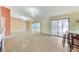 Spacious living room with a bar seating area and sliding glass door to the outside at 3360 Paso Andres St, Las Vegas, NV 89146