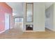 Bright living room featuring wood floors and a fireplace at 3360 Paso Andres St, Las Vegas, NV 89146