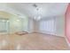 Bright living room featuring wood floors and an elegant chandelier at 3360 Paso Andres St, Las Vegas, NV 89146
