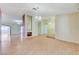 Open-concept living room with wood floors, fireplace, and access to other rooms at 3360 Paso Andres St, Las Vegas, NV 89146