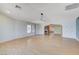 Bright, open living room with hardwood floors, recessed lighting, and architectural archway to the adjacent room at 3360 Paso Andres St, Las Vegas, NV 89146
