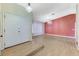 Open living room featuring wood floors, vaulted ceiling, and modern chandeliers at 3360 Paso Andres St, Las Vegas, NV 89146