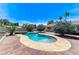 Outdoor pool area with a unique in-ground pool and spa combination on a brick patio at 3360 Paso Andres St, Las Vegas, NV 89146