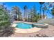 Backyard pool and spa offer a refreshing escape, surrounded by lush landscaping and privacy at 3360 Paso Andres St, Las Vegas, NV 89146