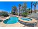 Sparkling pool and spa offer a private retreat in this serene backyard oasis, perfect for relaxation at 3360 Paso Andres St, Las Vegas, NV 89146