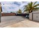 Open backyard with brick patio, shed, basketball hoop, and palm tree offering space for entertainment at 3417 Lillis Cir, North Las Vegas, NV 89030
