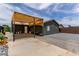 Private backyard featuring a covered patio, brick flooring, and ample space for outdoor activities and relaxation at 3417 Lillis Cir, North Las Vegas, NV 89030