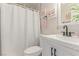 Clean bathroom with white quilted shower curtain, vanity, modern sink, and decorative accents at 3417 Lillis Cir, North Las Vegas, NV 89030