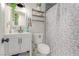 Bright bathroom features a floral shower curtain, modern fixtures, and stylish decor at 3417 Lillis Cir, North Las Vegas, NV 89030