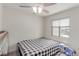 Bedroom features a bed, a drum set, and a window with blinds at 3417 Lillis Cir, North Las Vegas, NV 89030