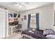 This bedroom features a TV, a computer and desk, posters, and a double bed at 3417 Lillis Cir, North Las Vegas, NV 89030