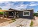 Inviting home exterior showcasing a cozy front porch with seating and well-maintained landscaping at 3417 Lillis Cir, North Las Vegas, NV 89030