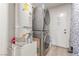 Laundry room featuring washer and dryer, and a water heater at 3417 Lillis Cir, North Las Vegas, NV 89030