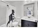 Bathroom with a black and white theme including a dinosaur shower curtain at 382 Gracious Way, Henderson, NV 89011