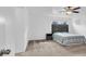 Cozy bedroom featuring carpet, a comfortable bed, and a ceiling fan for comfort at 382 Gracious Way, Henderson, NV 89011