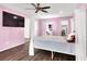 Light pink bedroom with a four poster bed at 382 Gracious Way, Henderson, NV 89011