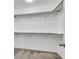 Bright walk-in closet with wooden rods and ample shelving for organization at 382 Gracious Way, Henderson, NV 89011