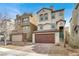 Two-story home with a two-car garage and a well-maintained, xeriscaped front yard and tile roof at 382 Gracious Way, Henderson, NV 89011