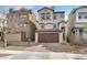 Two-story home with a two-car garage and a well-maintained, xeriscaped front yard and tile roof at 382 Gracious Way, Henderson, NV 89011