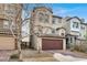 Two-story home with a two-car garage and a well-maintained, xeriscaped front yard and tile roof at 382 Gracious Way, Henderson, NV 89011